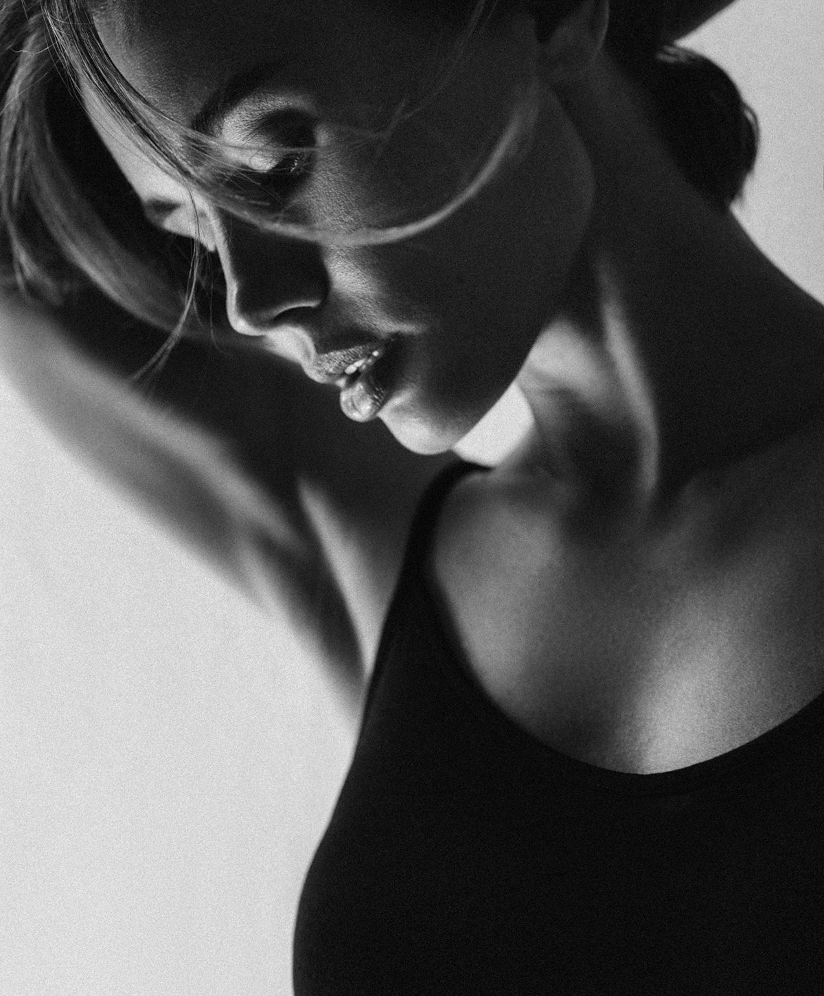 Black and white portrait of a thoughtful woman.