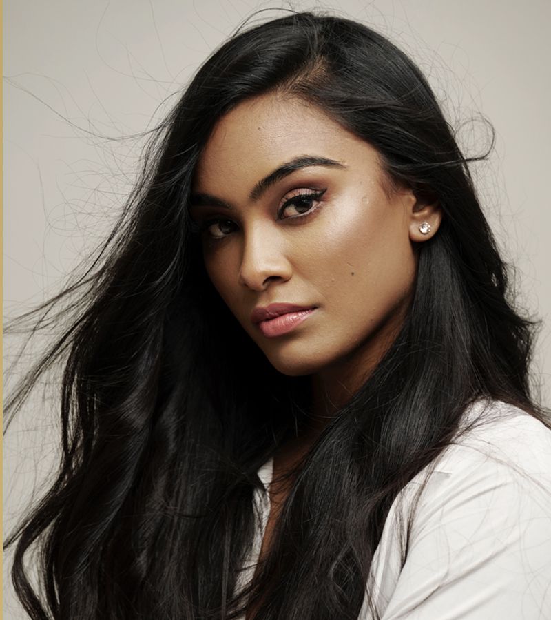 Portrait of a woman with long, flowing hair.