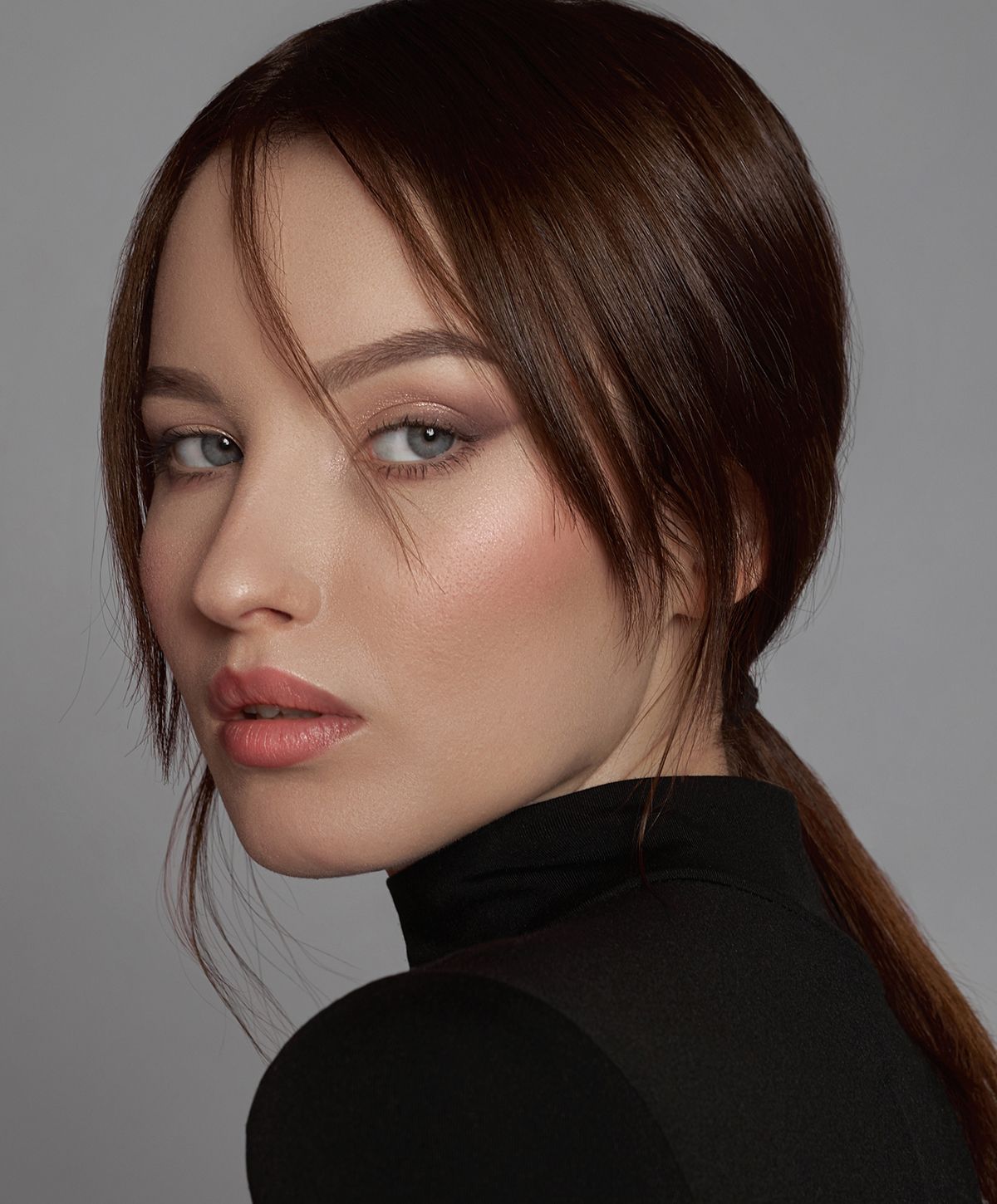 Portrait of a woman with stylish hair and makeup.