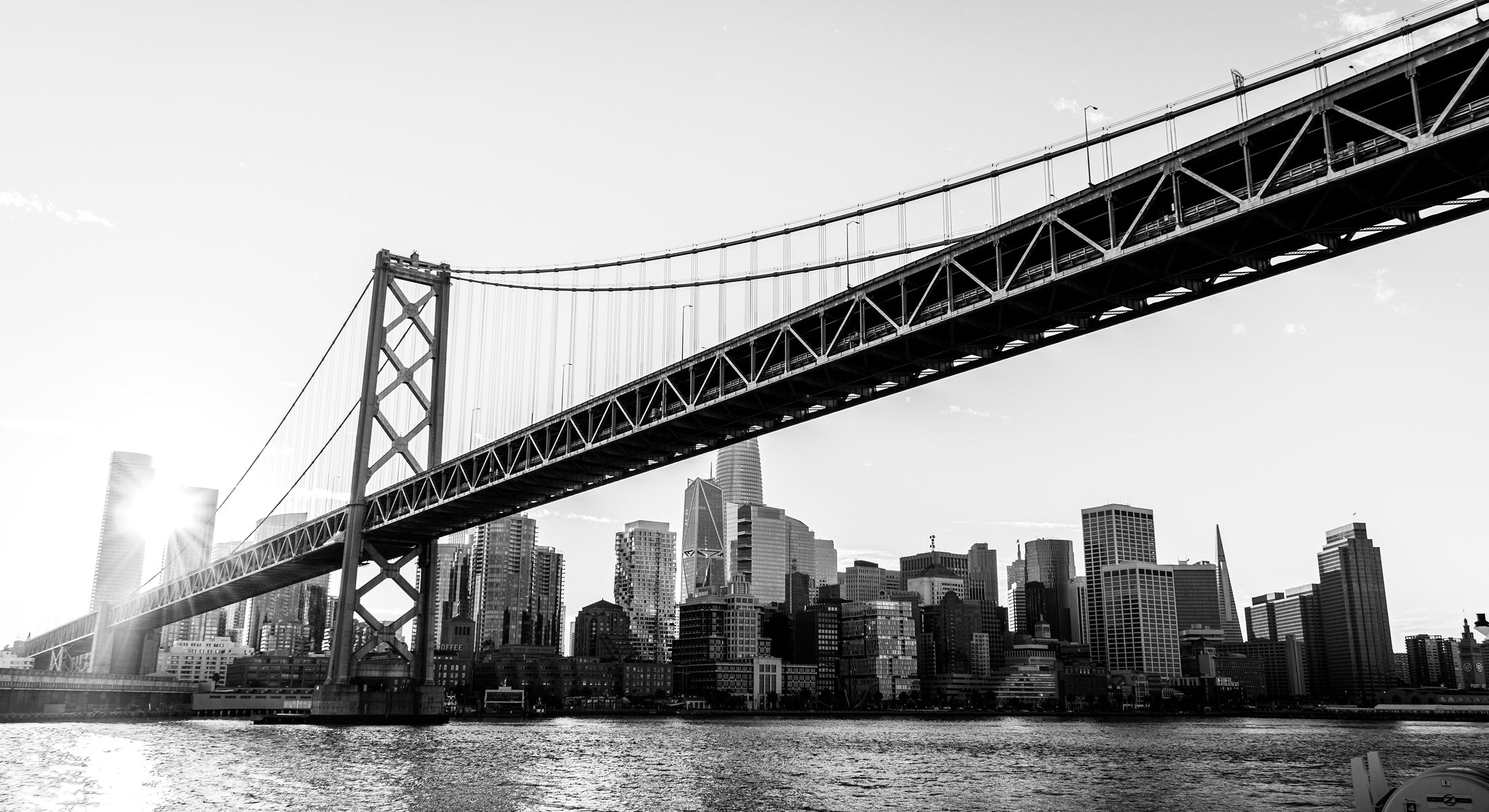 Bay Bridge with city skyline in black and white.